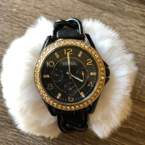 Black and gold Fossil watch